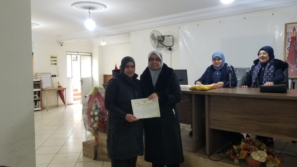 20251224_114114-1024x576 حفل تكريم الفوج الرابع و الخامس من المستفيدات  من الدورات التكوينية  في "تجهيز الميت وفق المذهب المالكي"